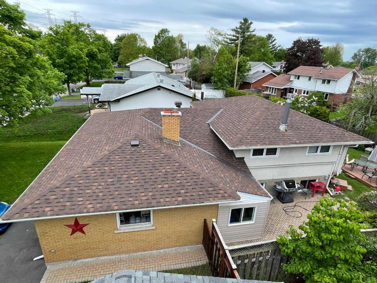 Overhead image of newly installed asphalt roof.